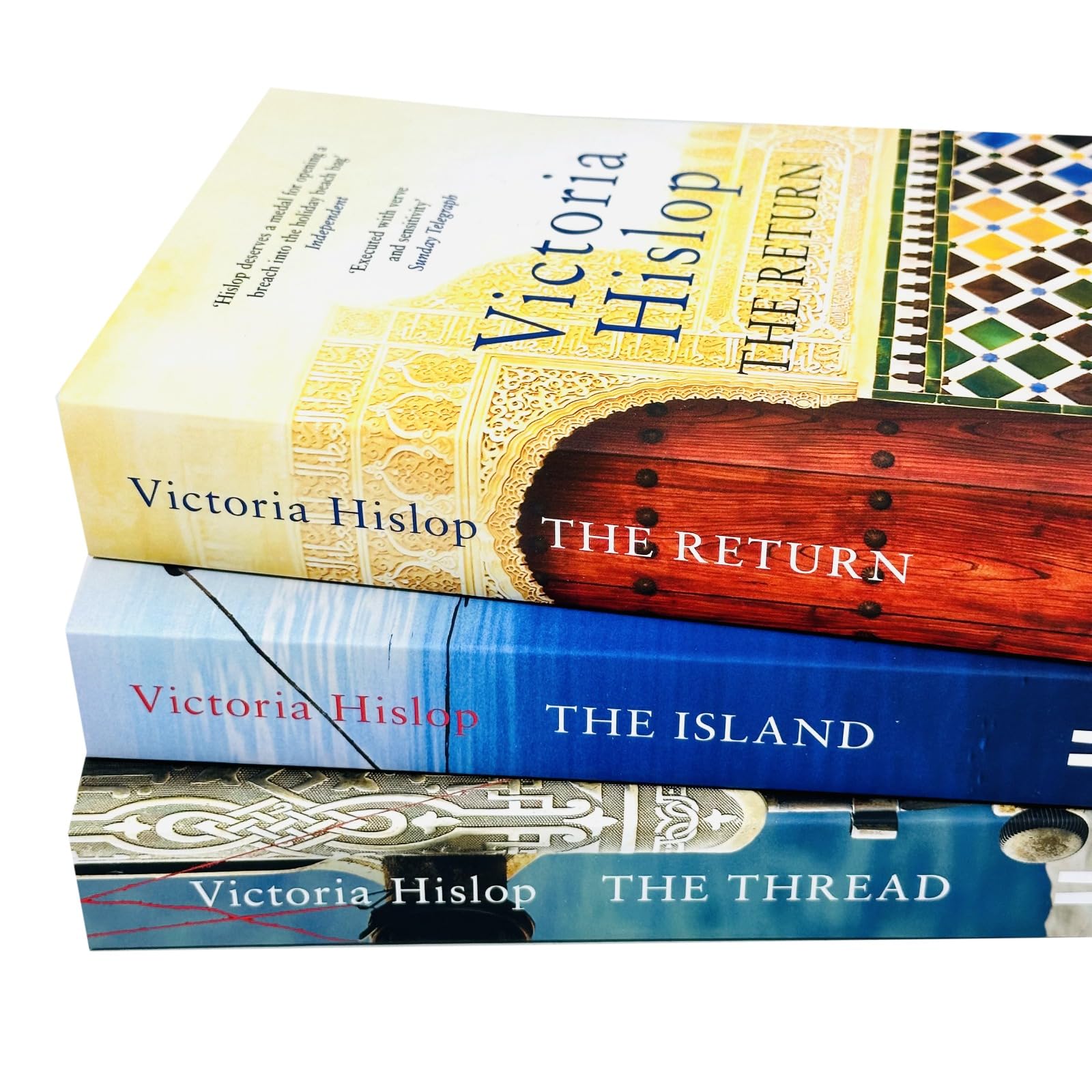 Angled view of the Victoria Hislop 3-book paperback collection highlighting spine and cover details of each novel.