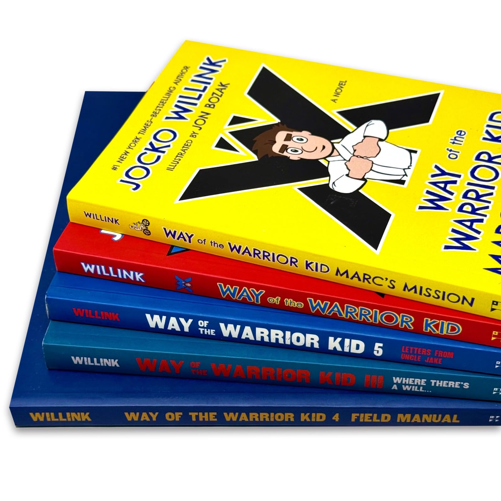 Close-up of the Way of the Warrior Kid paperback book spines showing the 4-book set by Jocko Willink
