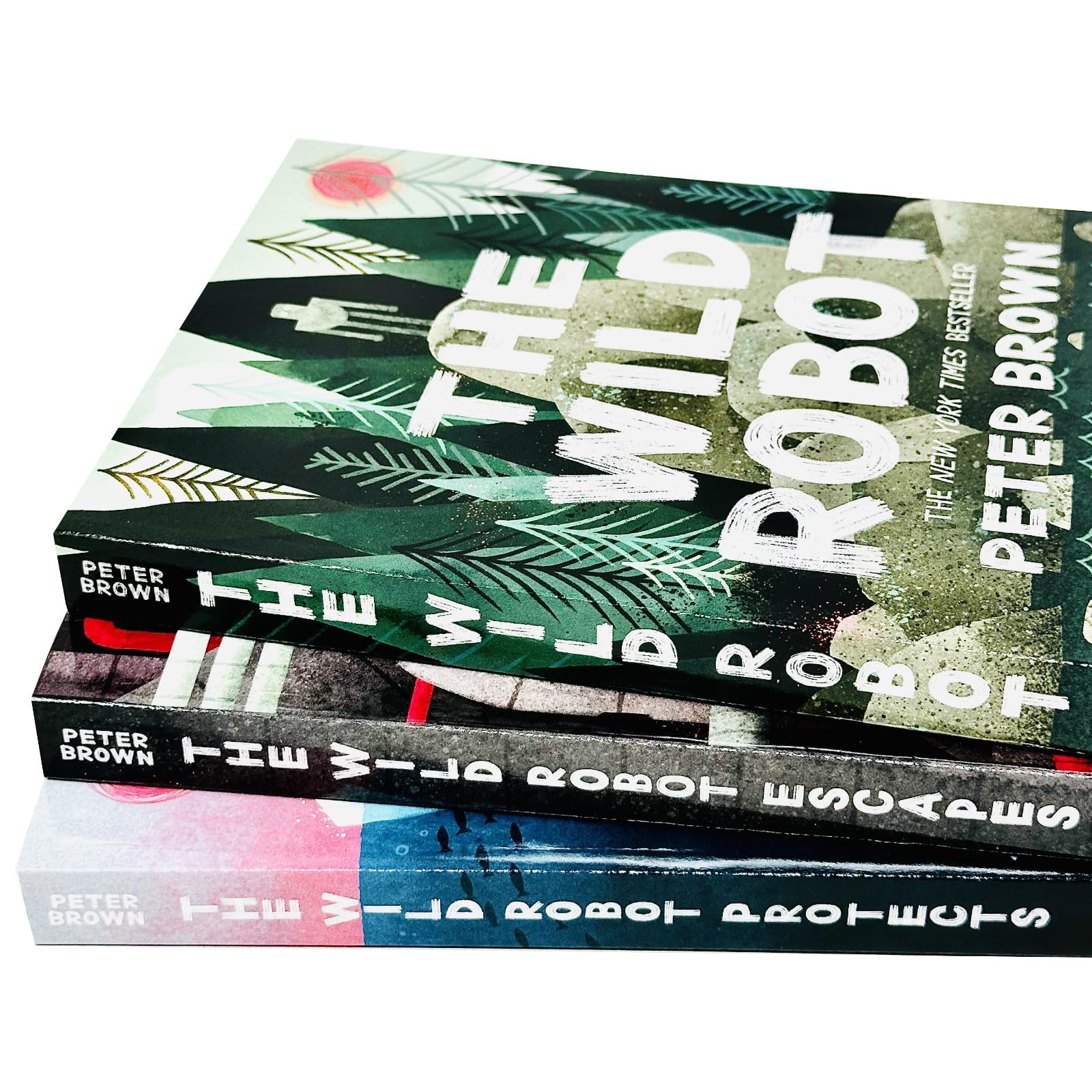 Back cover and spine detail of The Wild Robot paperback trilogy by Peter Brown, ages 8-12 middle grade collection